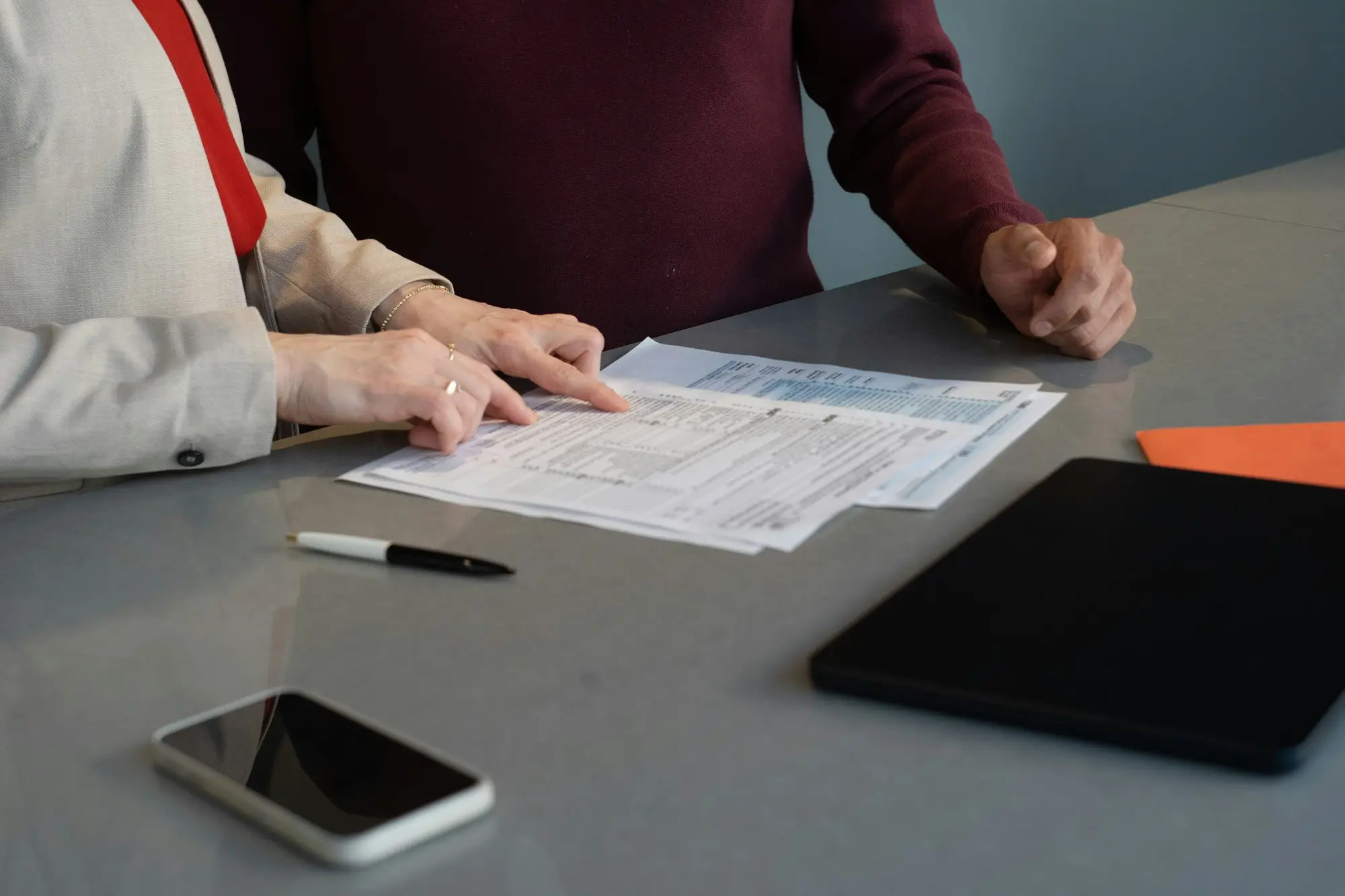 Tradie catching up on overdue BAS paperwork at a desk to stop ATO failure to lodge penalties