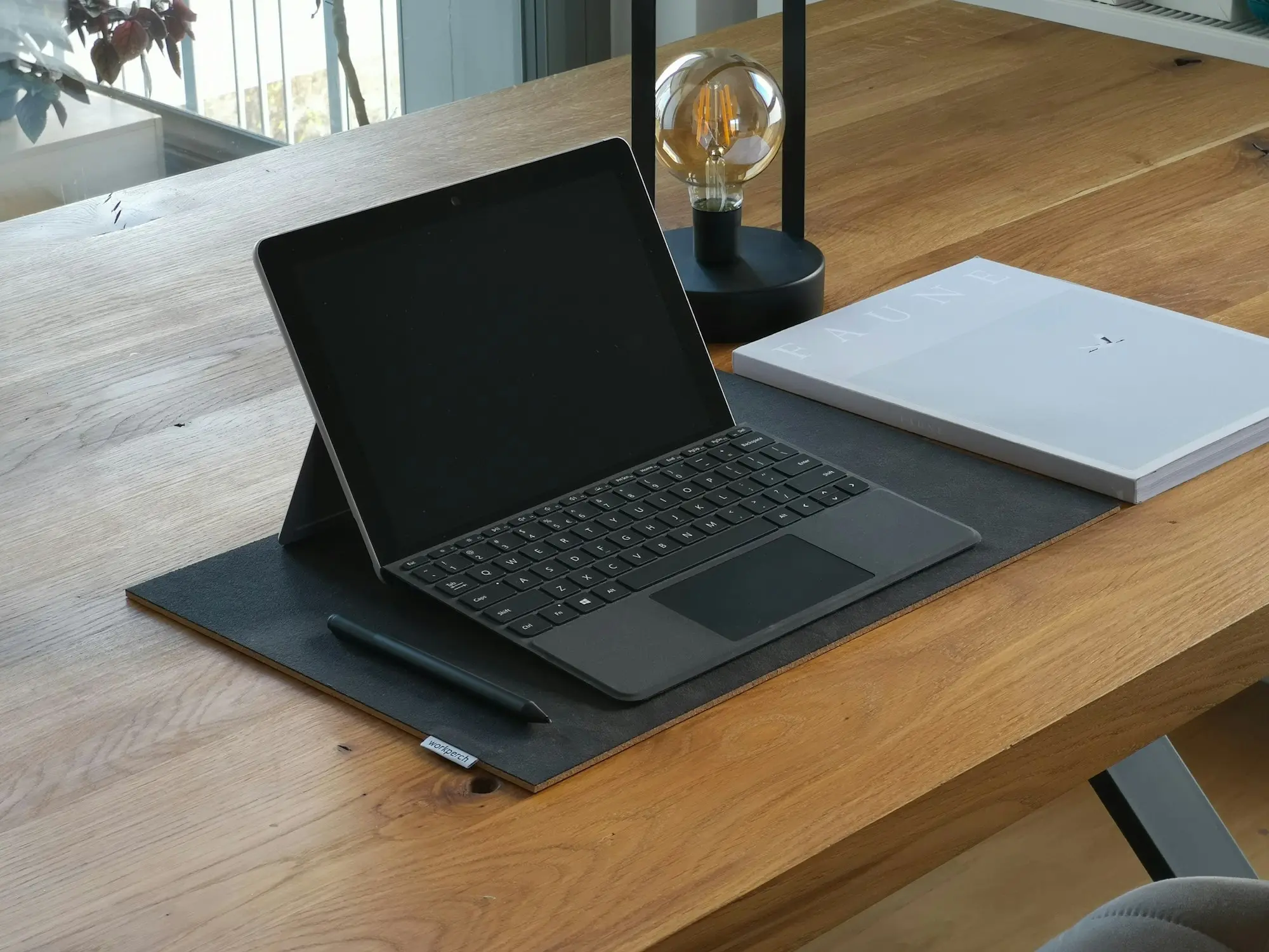 Laptop on a tidy desk used to manage a business overdraft and daily cash