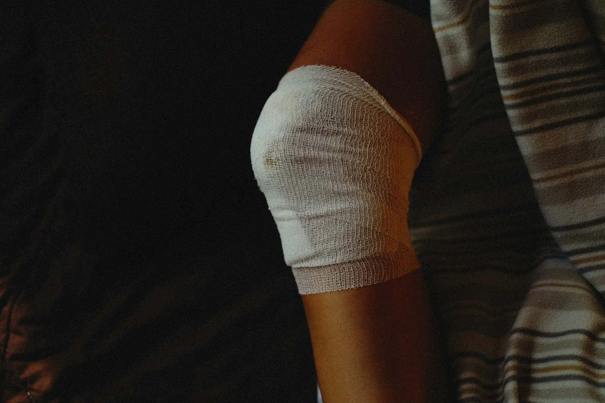Injured tradie with an arm in a sling planning how to keep the business funded while recovering