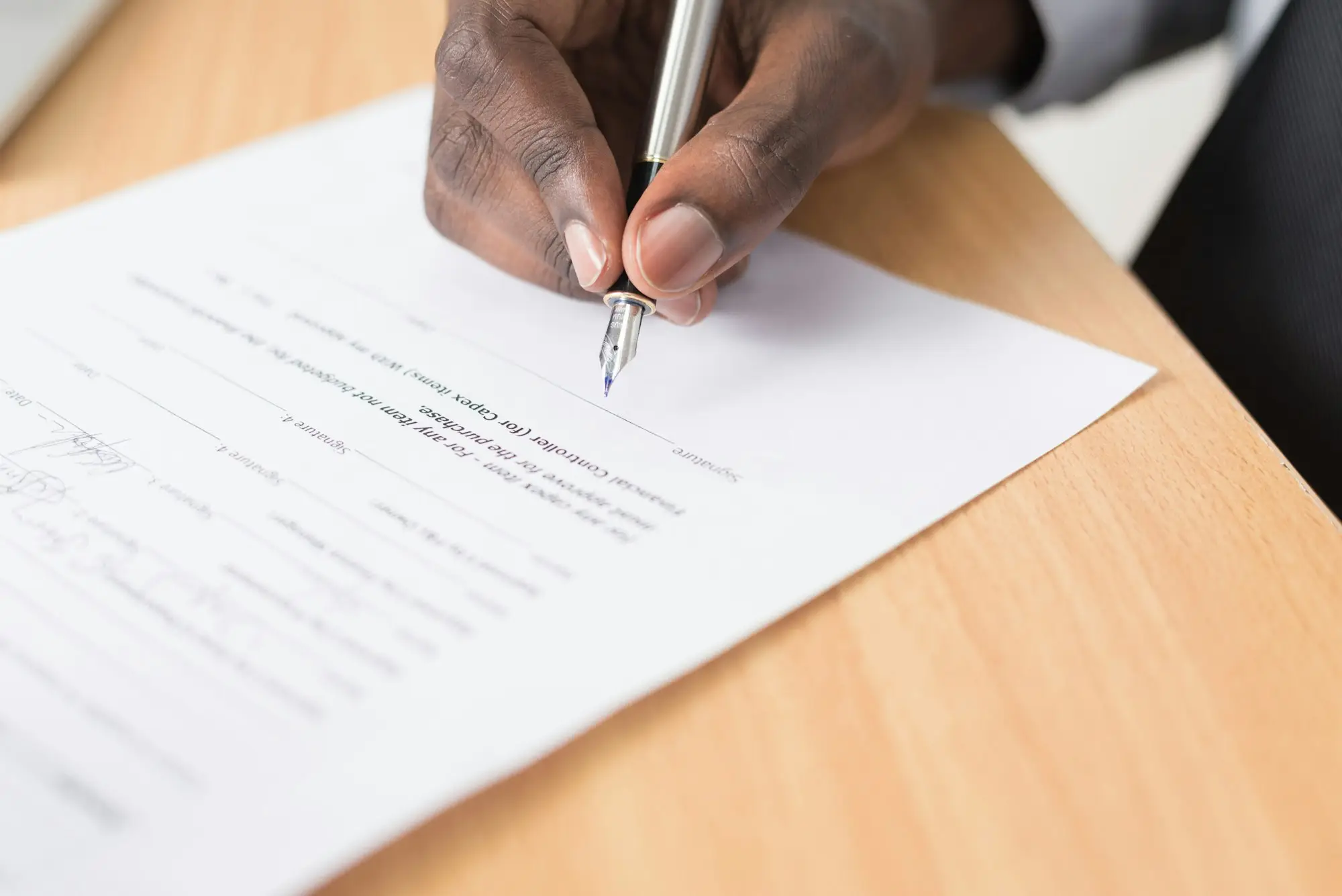 Borrower signing loan documents for a caveat loan