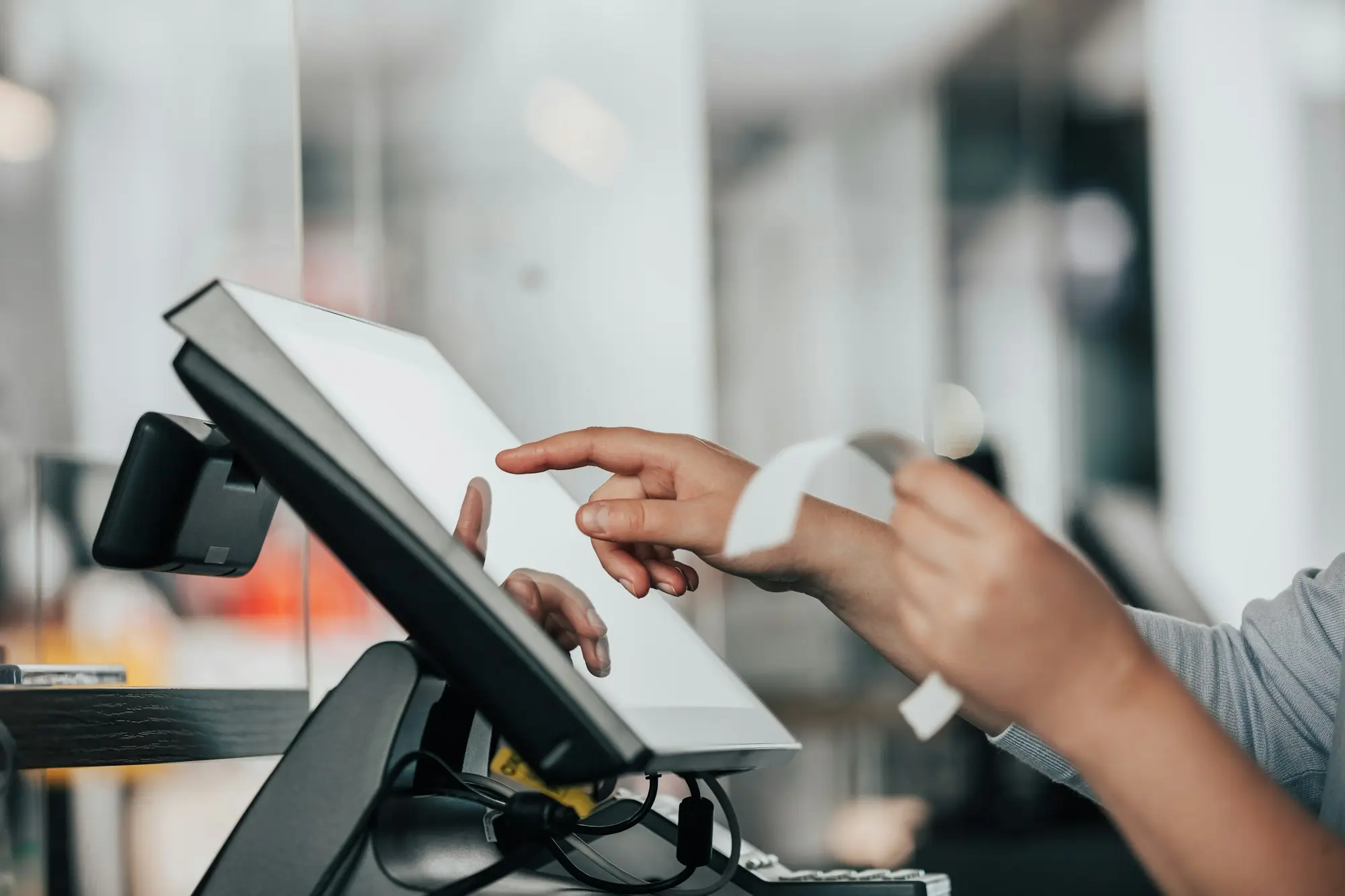 New EFTPOS terminal on a shop counter as the owner changes payment provider while revenue-based finance is still being repaid