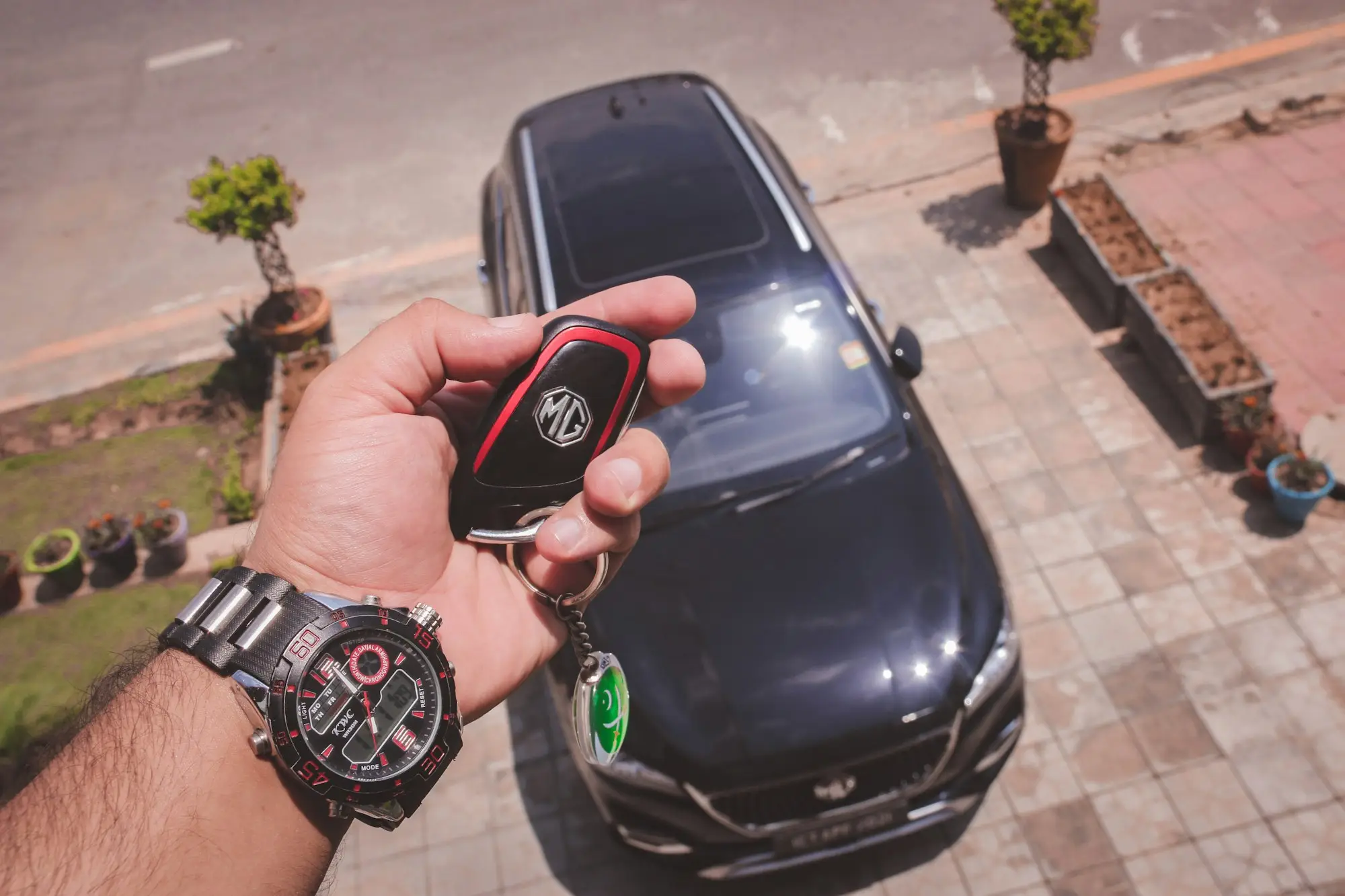 Hand holding the keys to a newly financed business car under a chattel mortgage
