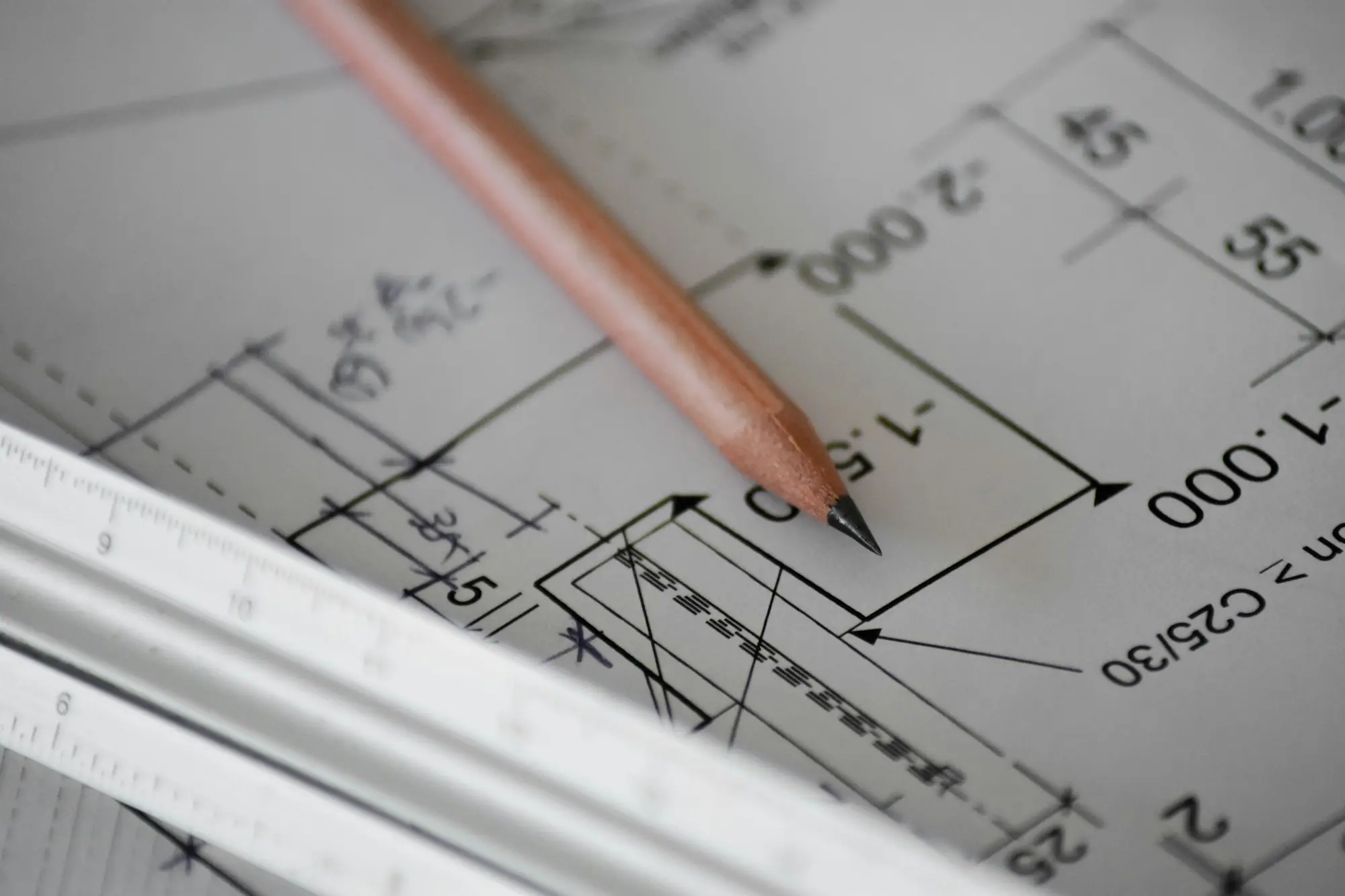 Developer checking a builder licence and ASIC company records on a laptop in a site office before applying for a development loan