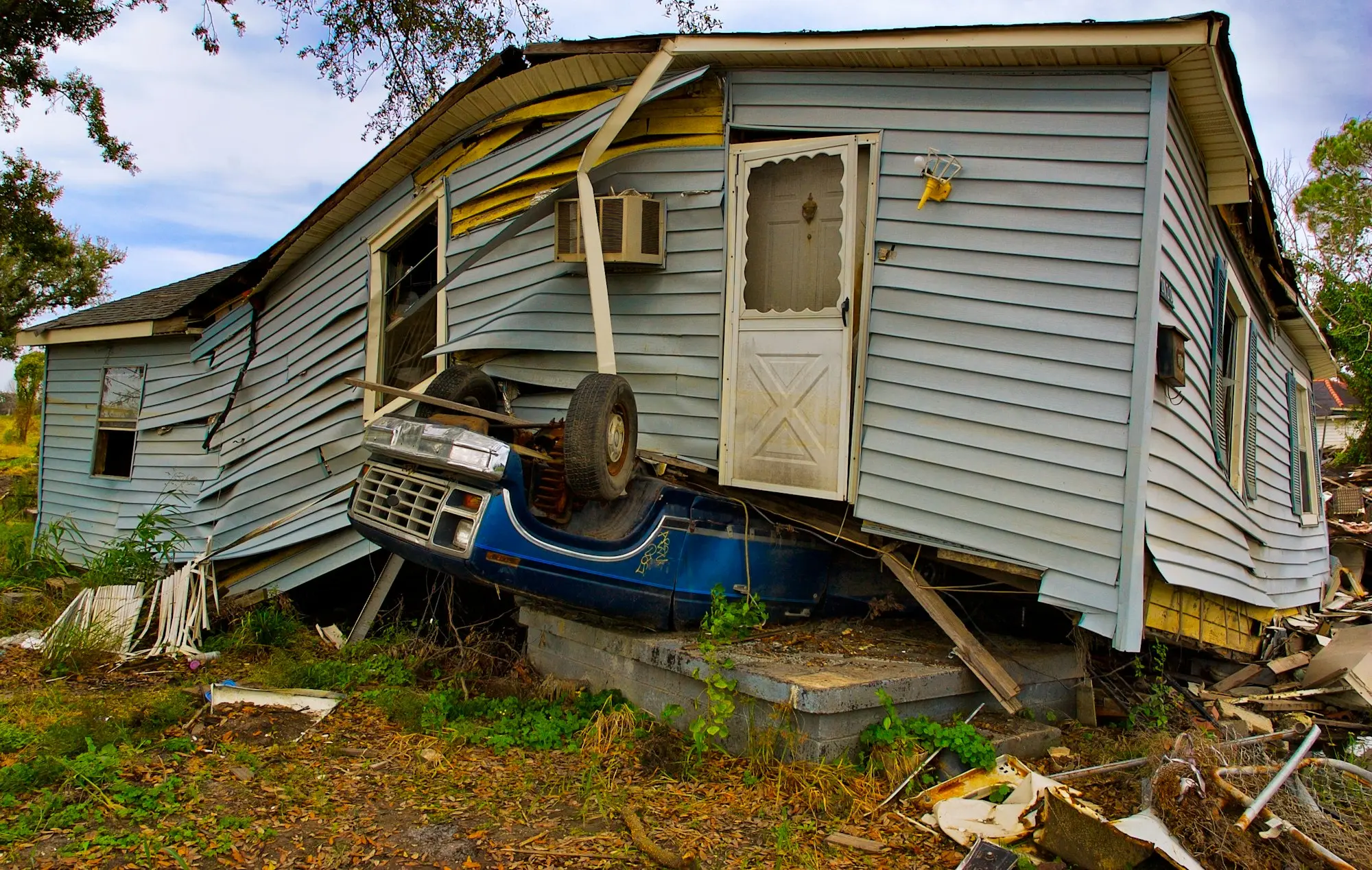 Storm-damaged building after severe weather, the kind of shock an emergency business loan helps with