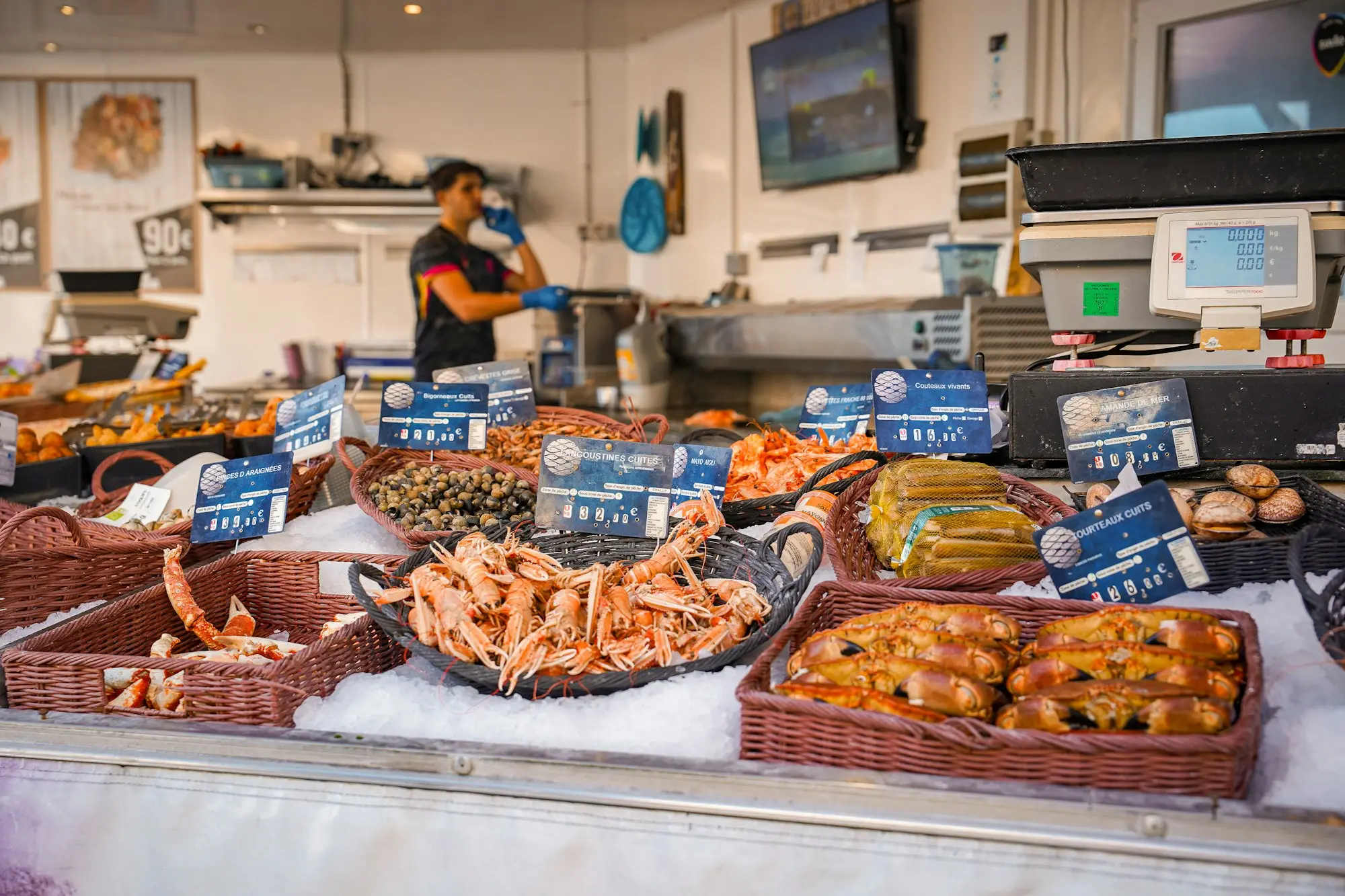 Takeaway shop counter with fryers and a menu board in a suburban fish and chip shop