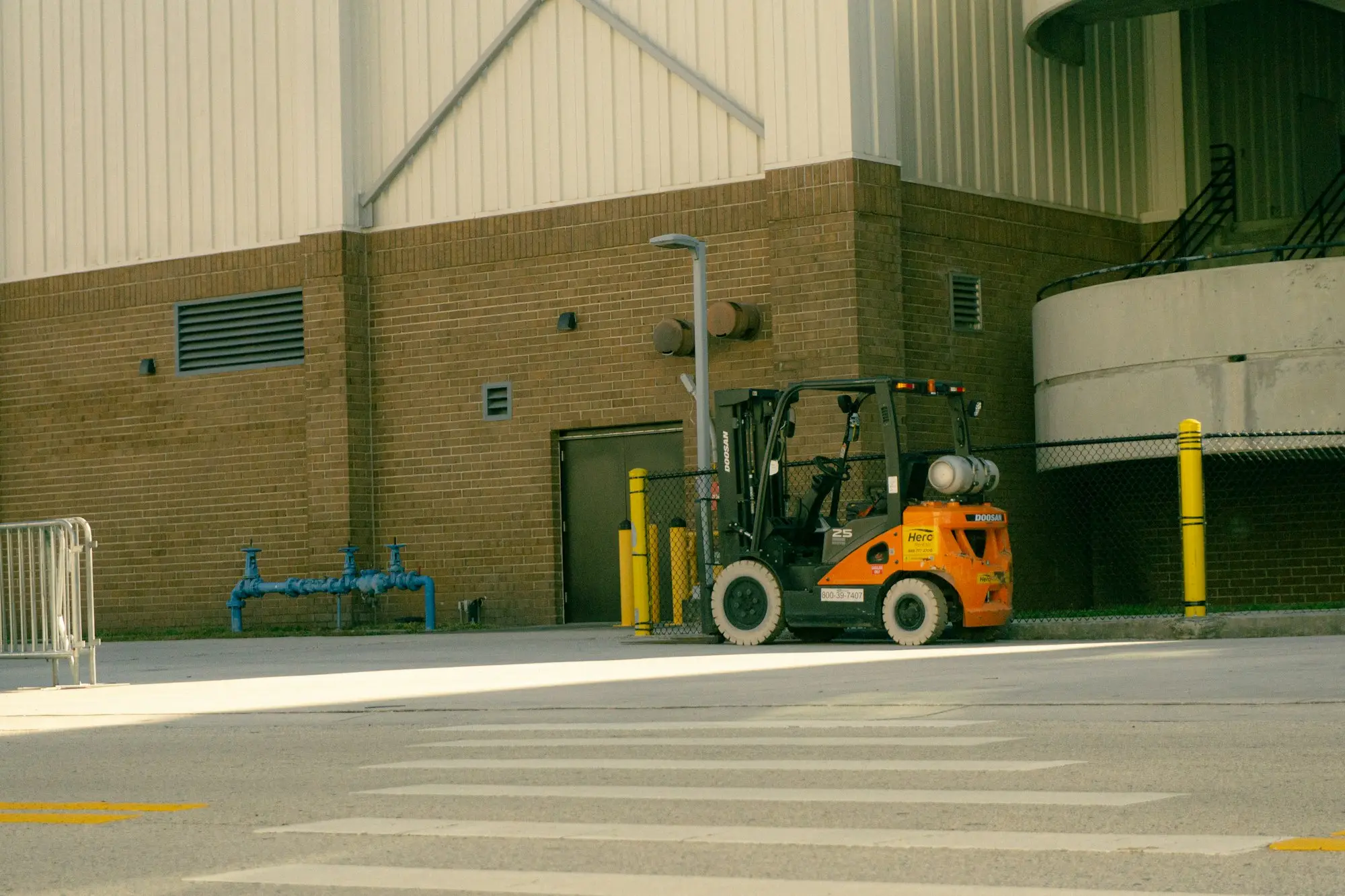 Forklift parked in a warehouse, a common asset on a finance or operating lease