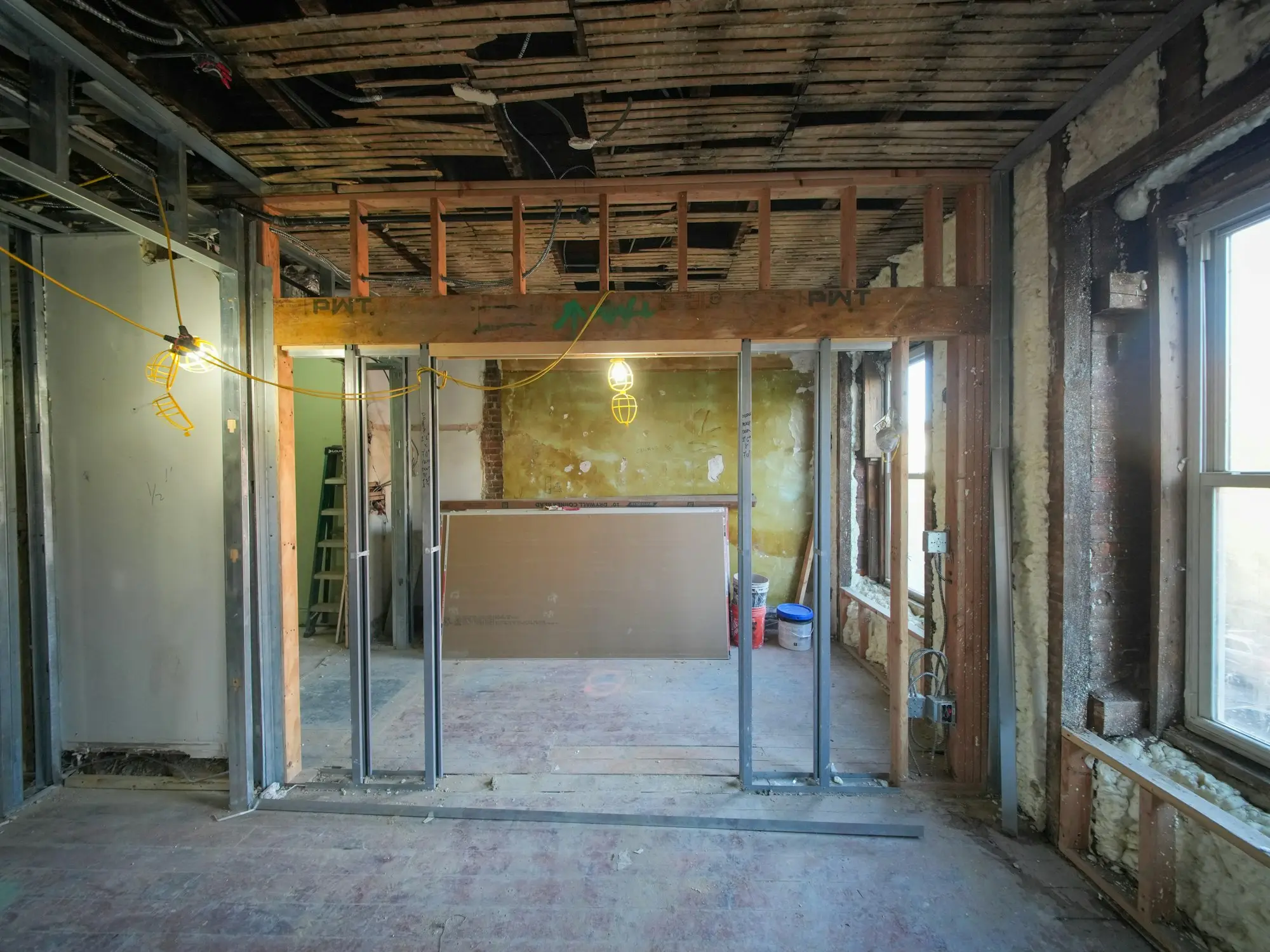 Business owner inspecting an unfinished shop fit-out that has gone over budget mid-build