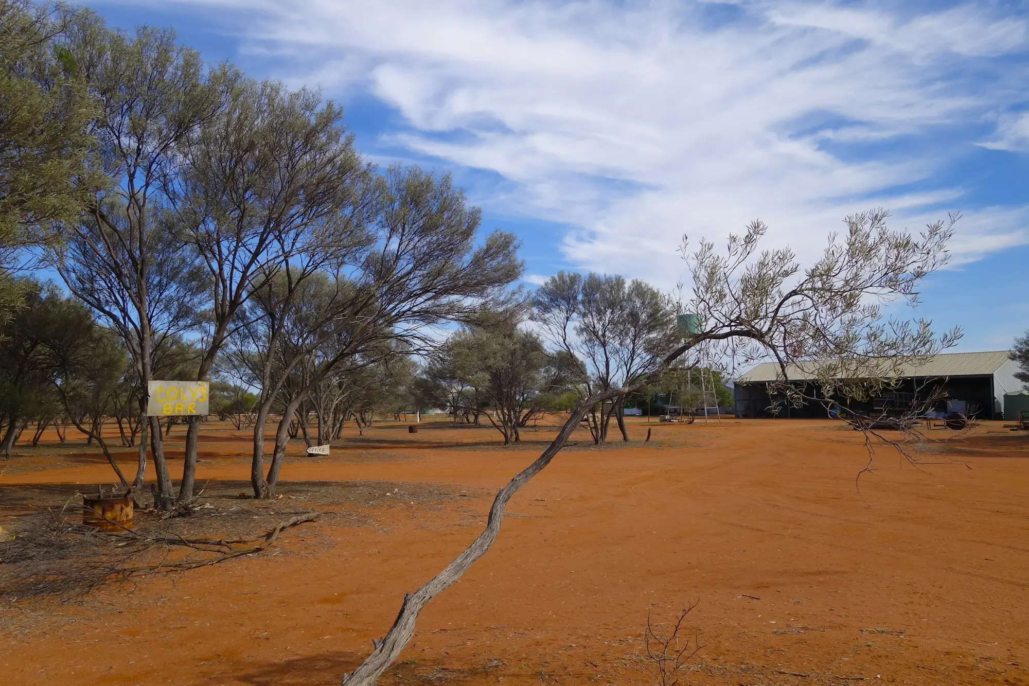 Rural Australian home bordered by bushland, used as property security for a business loan in a bushfire overlay area