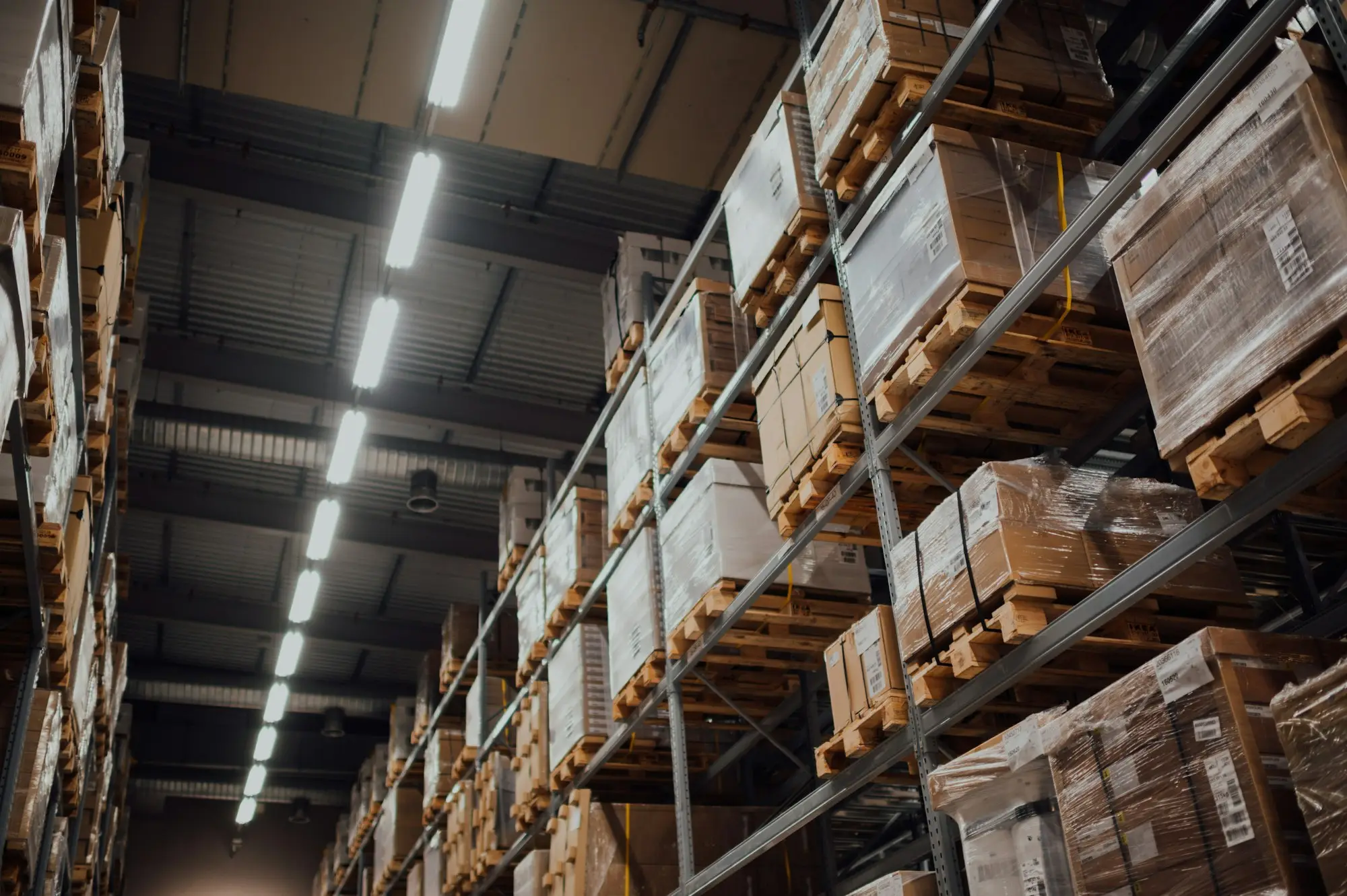 Pallets of packaged food on a loading dock ready for a supermarket delivery funded with invoice finance