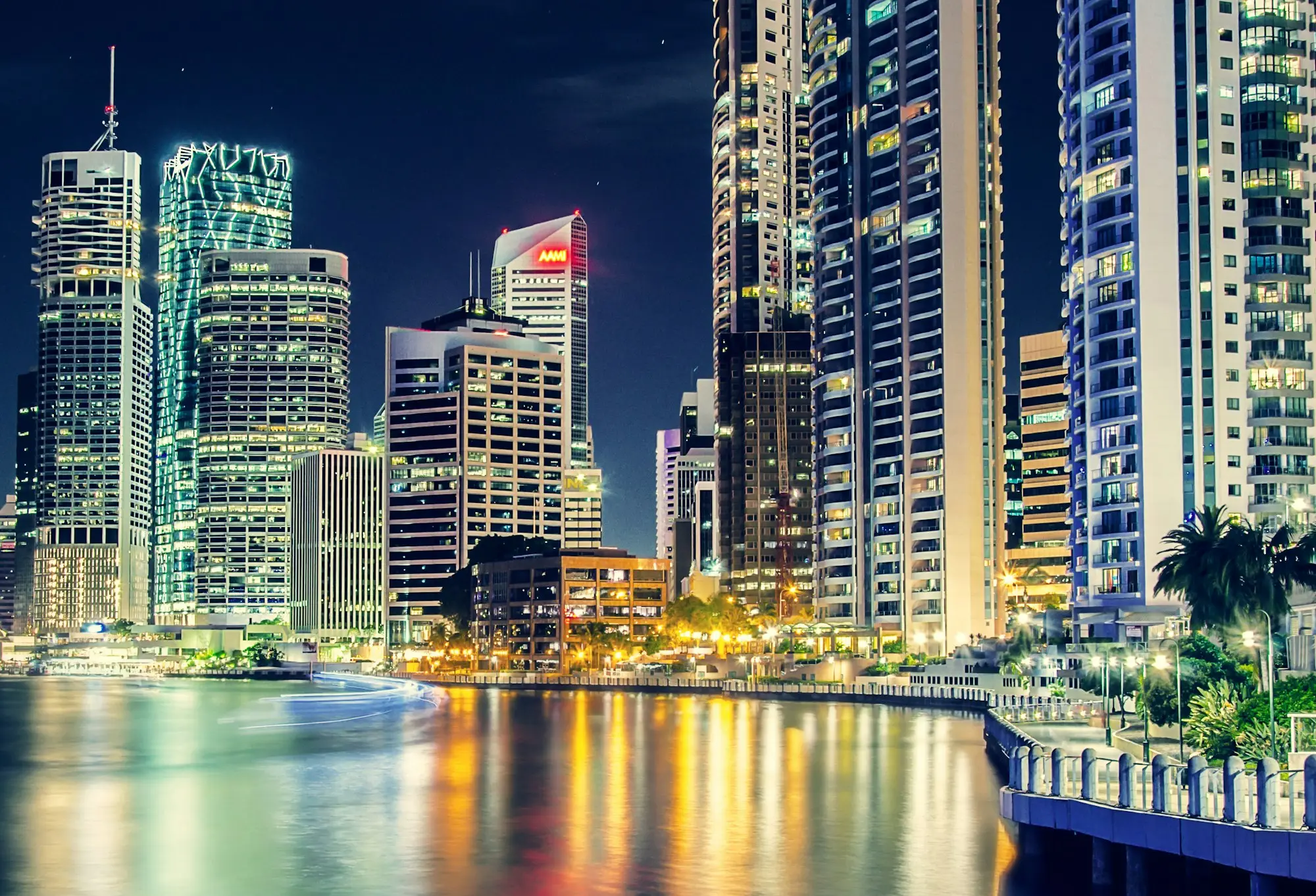 Brisbane CBD office towers lit up at night beside the river, home to many law and accounting firms