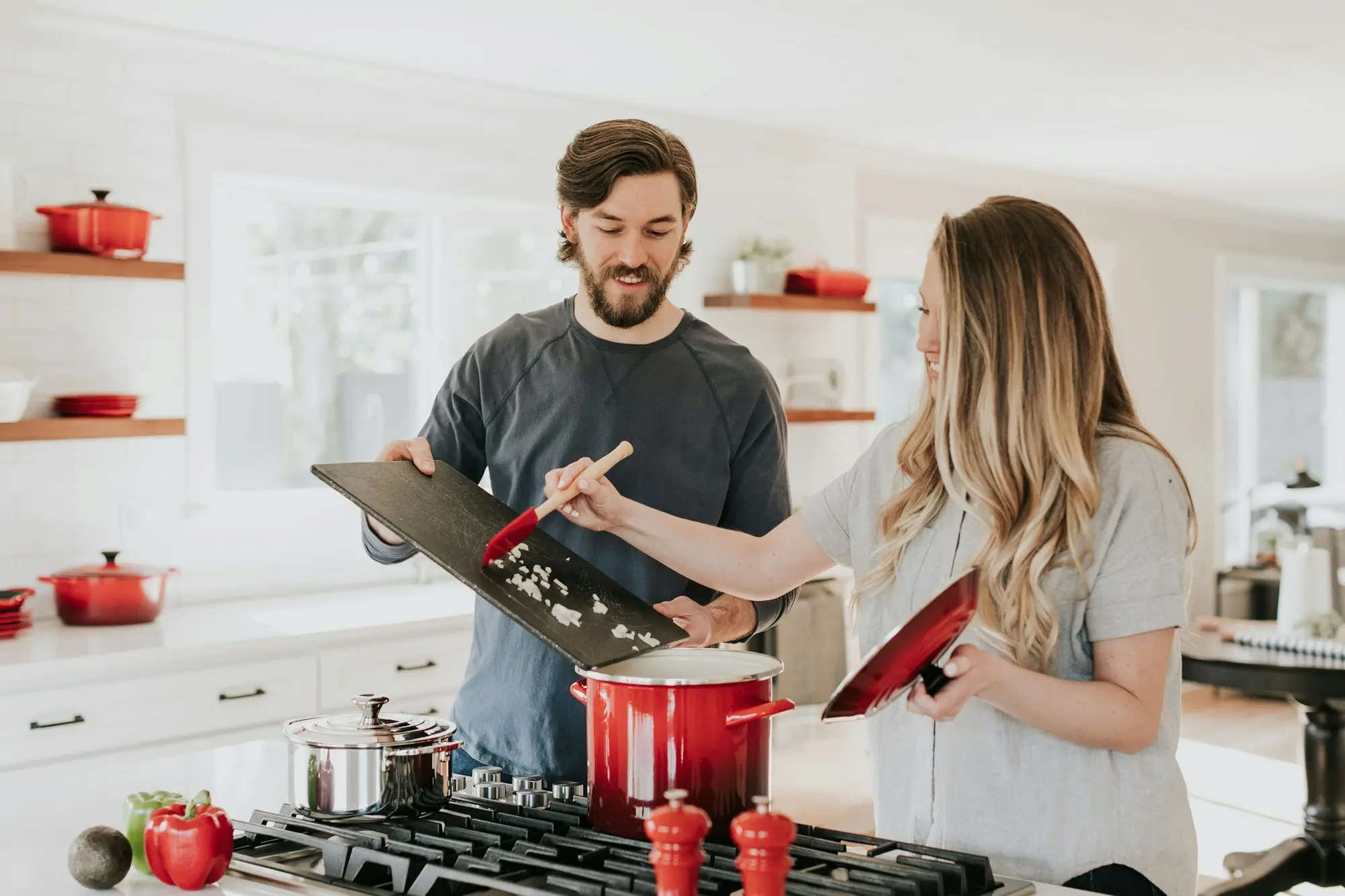 Couple reviewing family trust deed and bank statements at a kitchen table for a low doc business loan