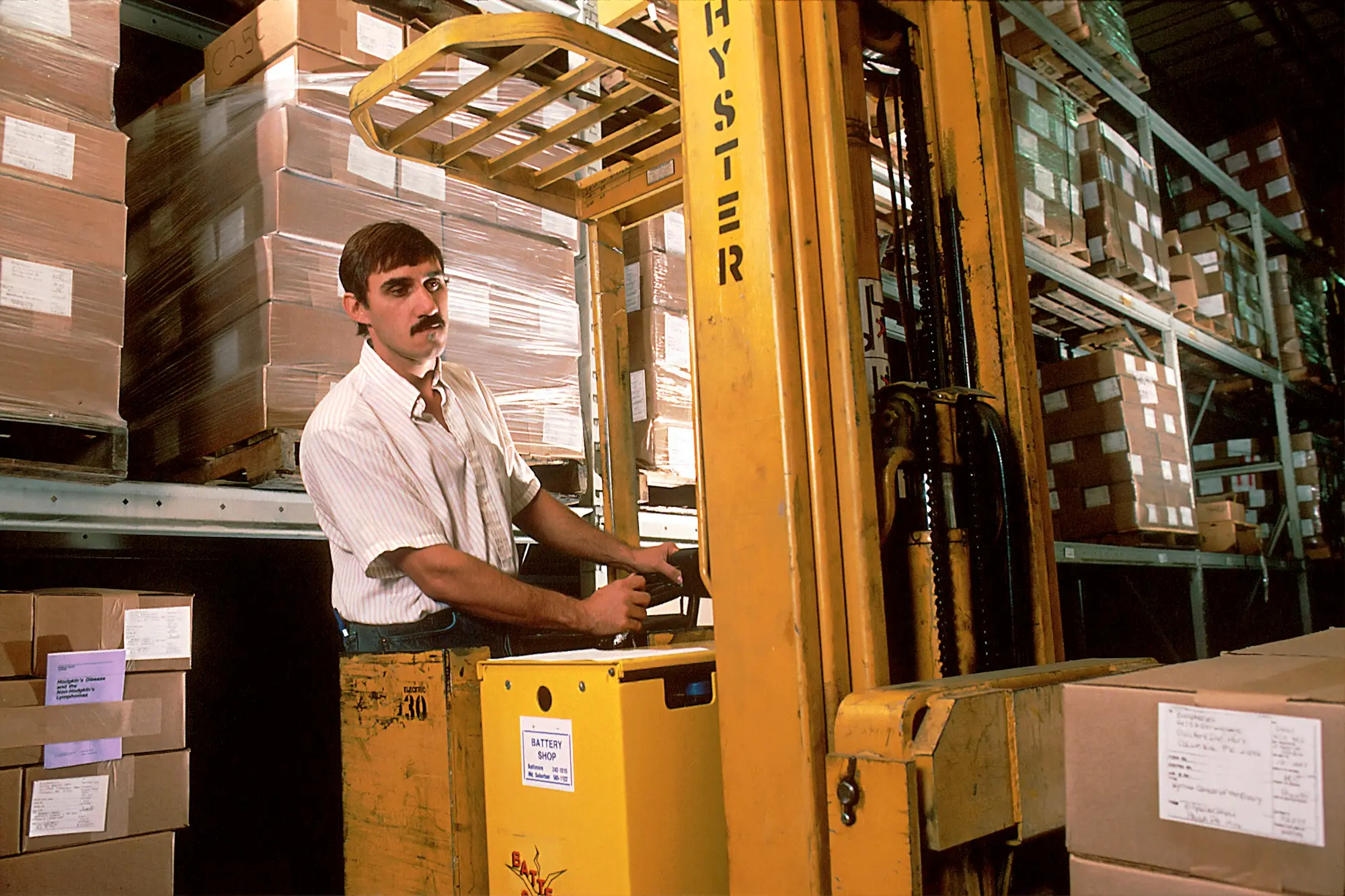 Leased forklift being inspected in a warehouse at the end of an operating lease