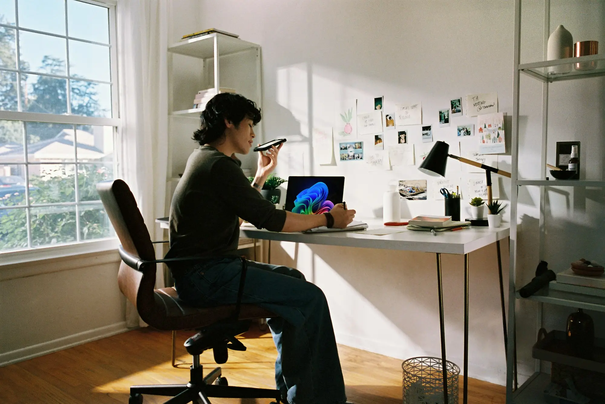 Australian business owner on a video call with an overseas director while preparing a business loan application