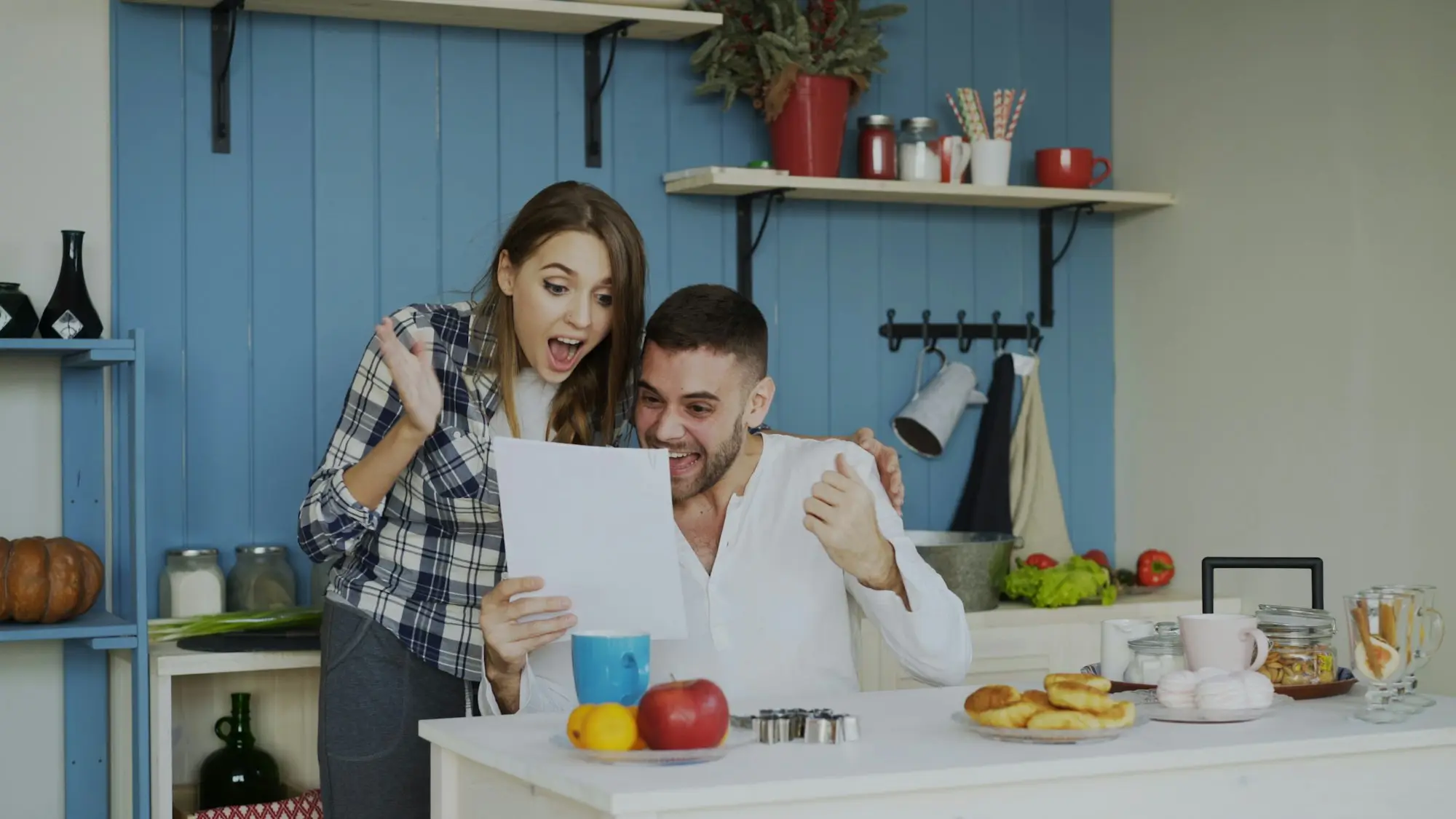 Two company directors reviewing an ATO tax debt statement while negotiating a partner buyout