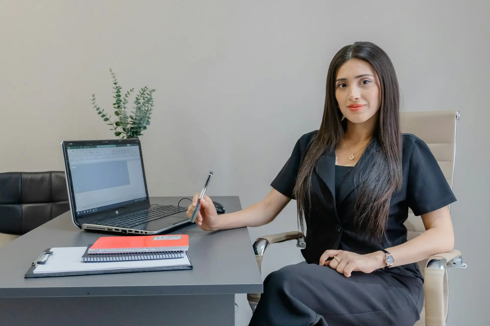 Small business owner reading the default and variation clauses of a private business loan contract before signing