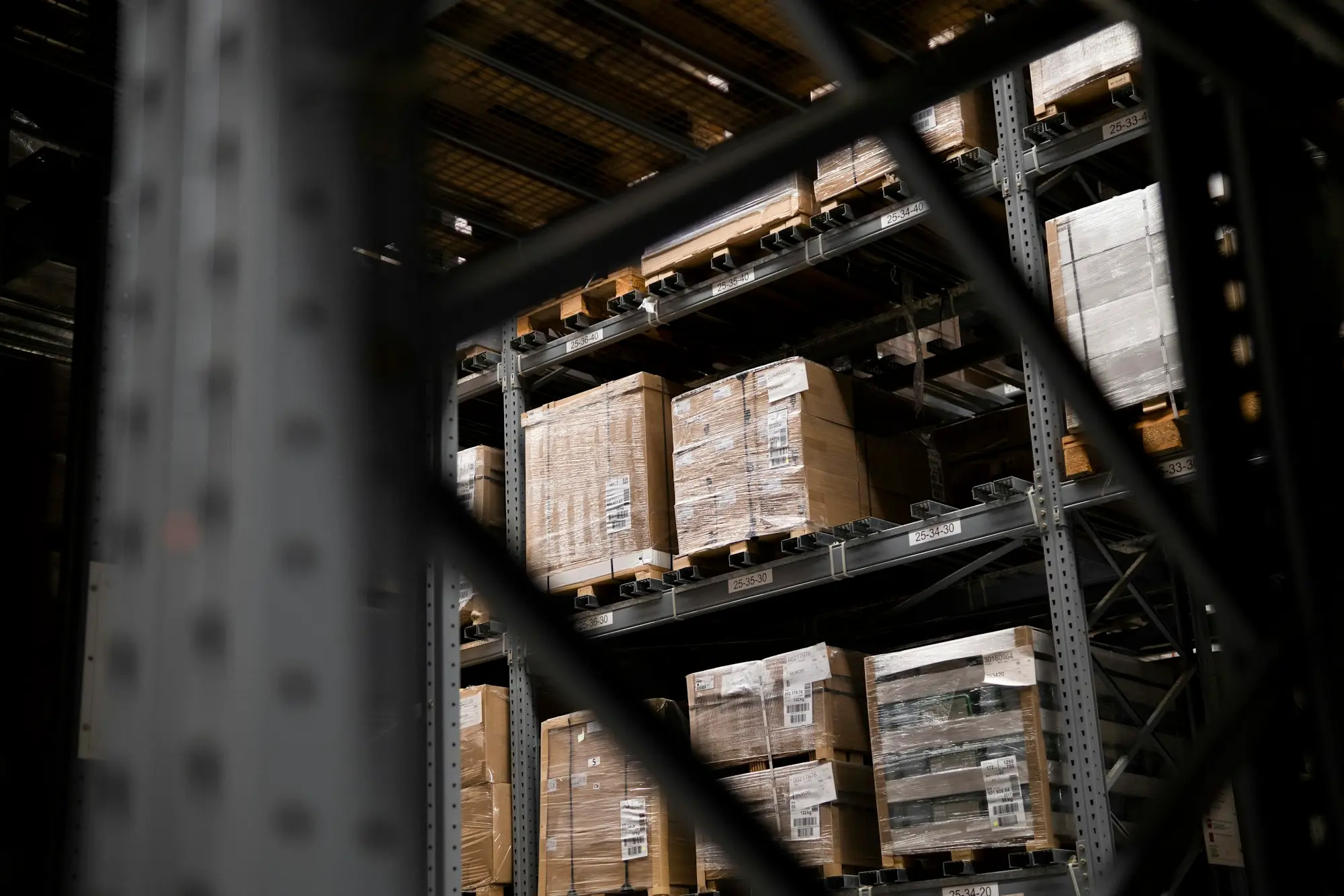 Pallets of boxed goods waiting in a warehouse after a customer cancelled an order funded with purchase order finance