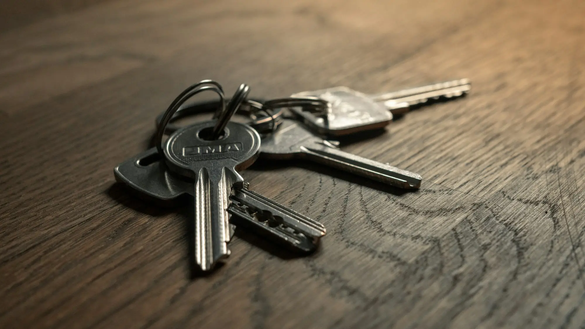 Keys being handed over in a newly completed apartment, illustrating renting out unsold units while a residual stock loan runs