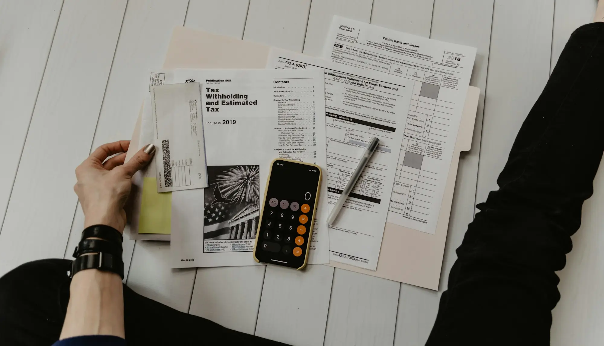 Accountant reviewing card settlement statements to work out whether a revenue-based finance fee is tax deductible