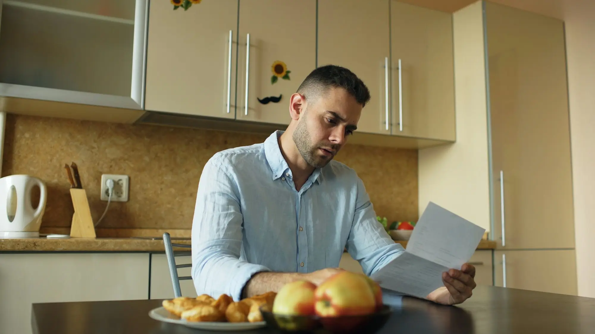 Business owner reading a state revenue office notice about a caveat lodged on their property title