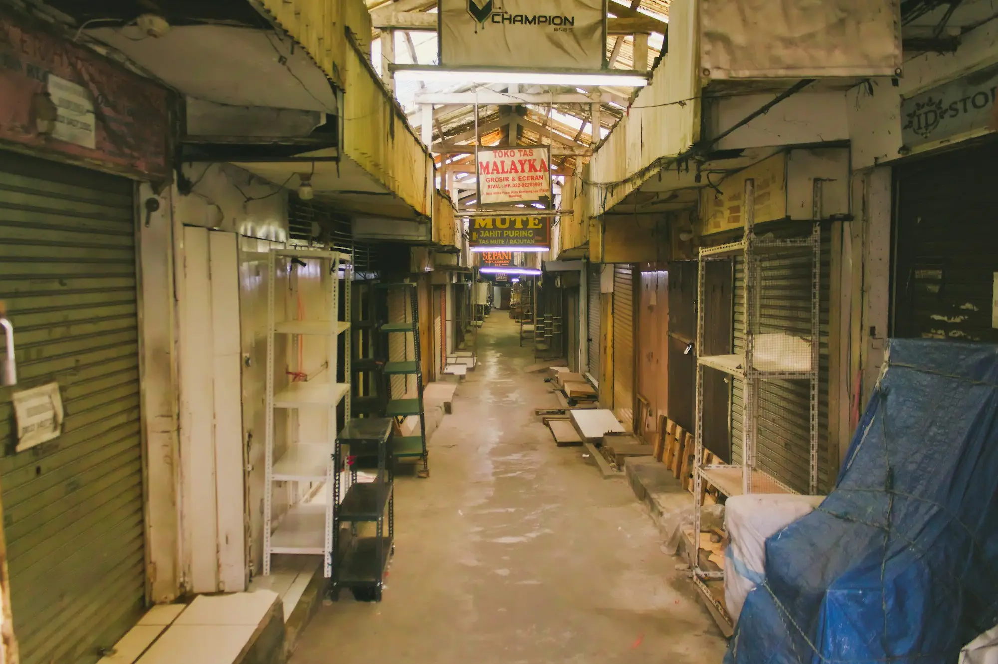 Half-empty stockroom shelves in a small business after a key supplier went into administration and the next delivery stalled