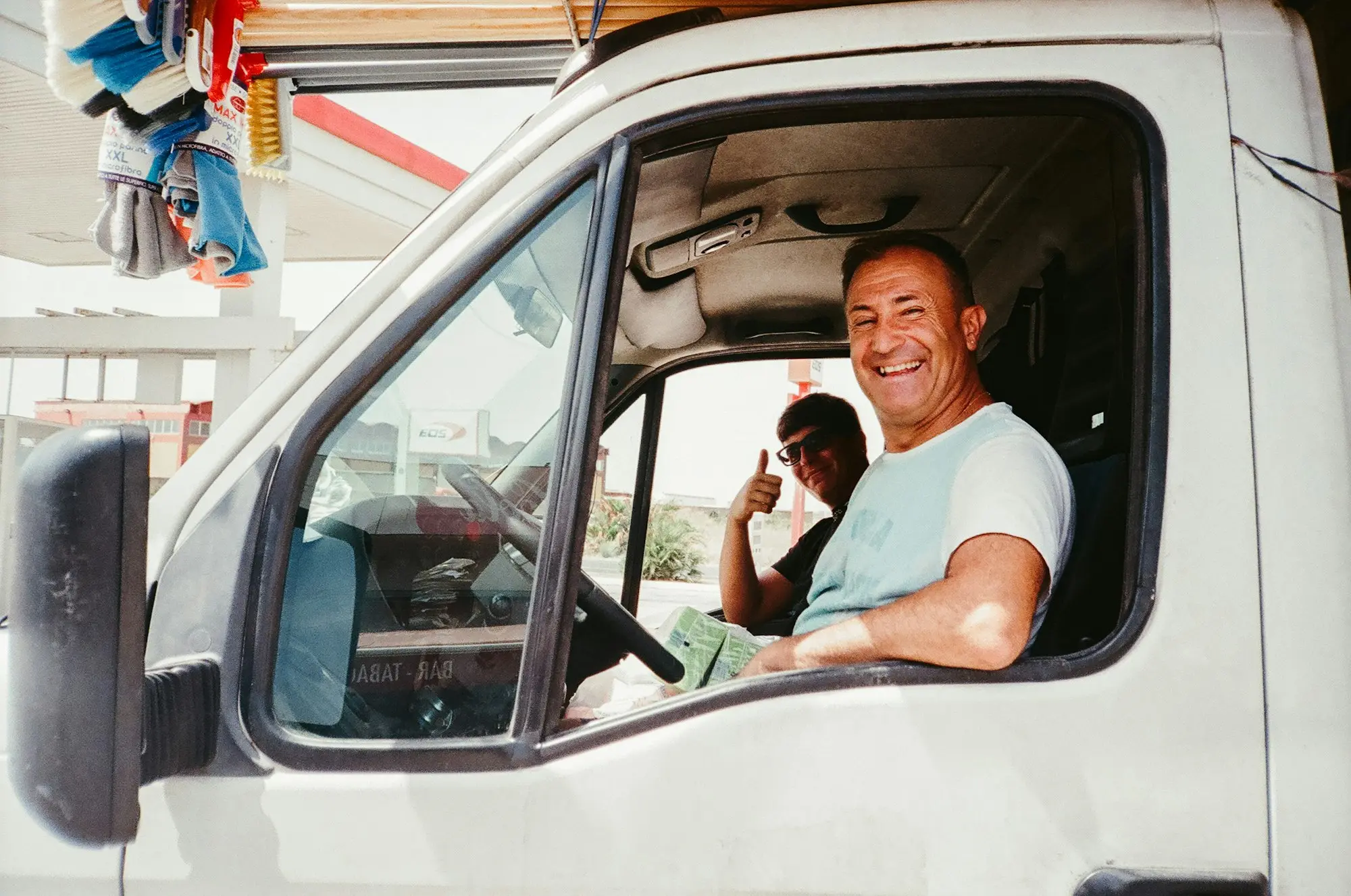 Transport operator reviewing tax paperwork in a truck cab before applying for truck finance with an ATO debt
