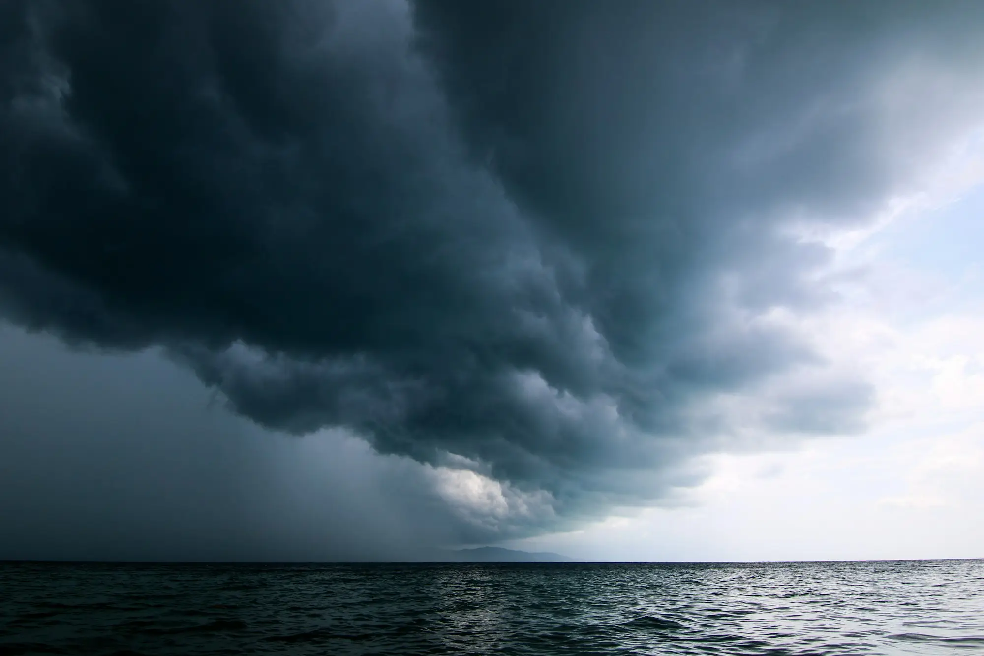 Tropical wet season storm over a northern Australian town, the quiet months a wet season business loan helps cover