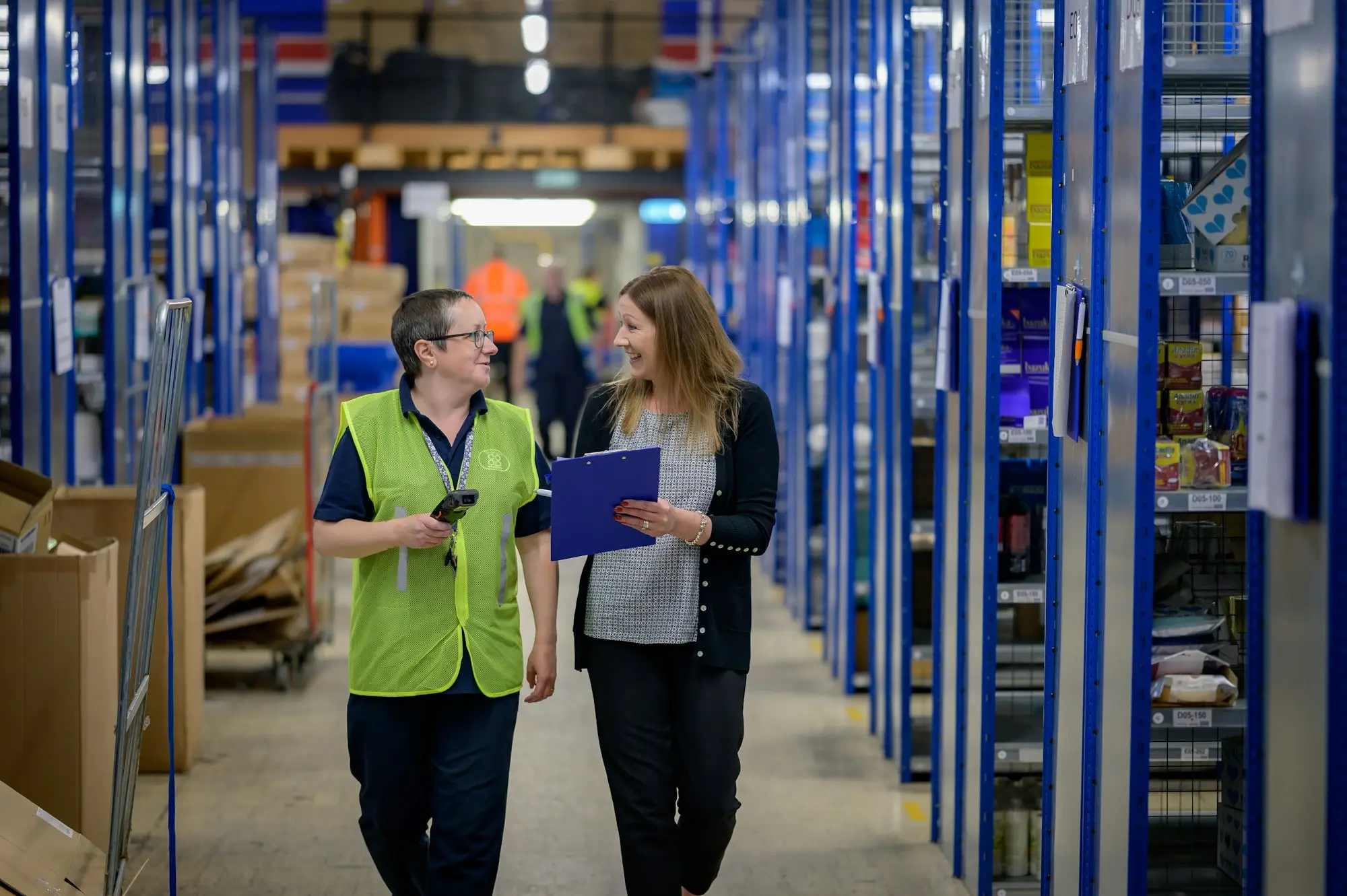 Warehouse staff checking stock, day-to-day operations funded by a working capital loan